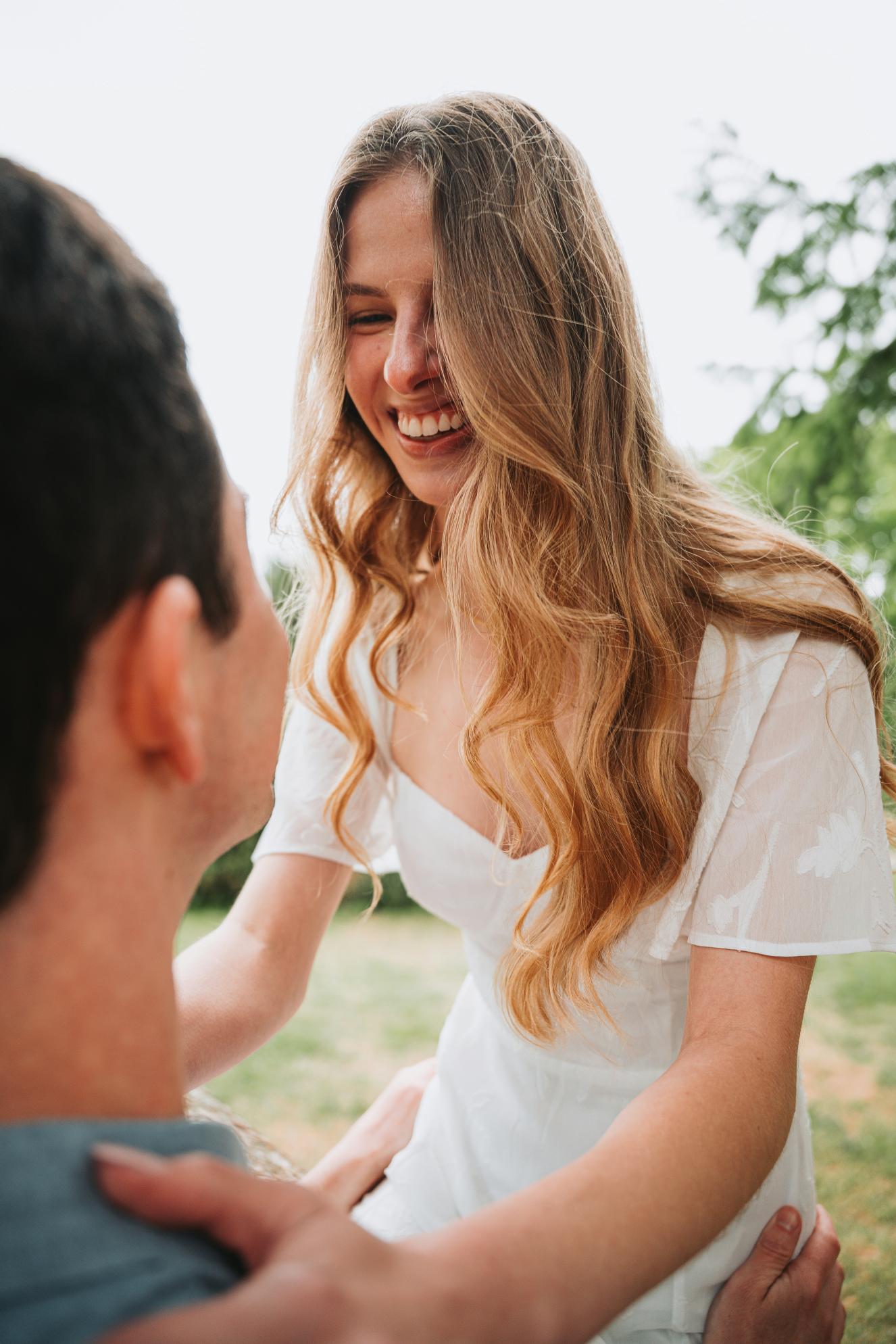 Couple laughing together outdoors